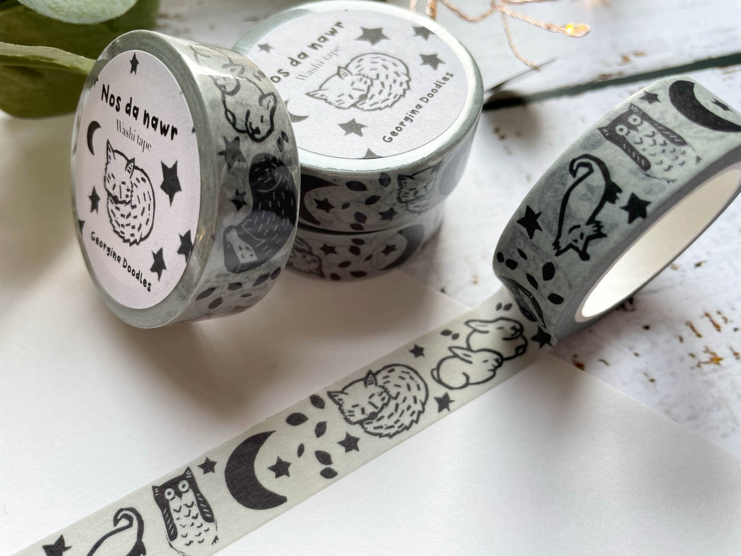 A close up of washi tape that's based on a lino print of woodland animals