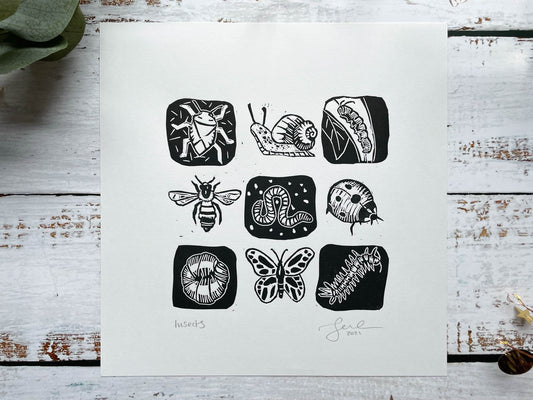 A lino print of a 3 x 3 grid of mini-beasts in black