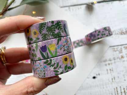 A close up of washi tape with a pink background and covered in flowers