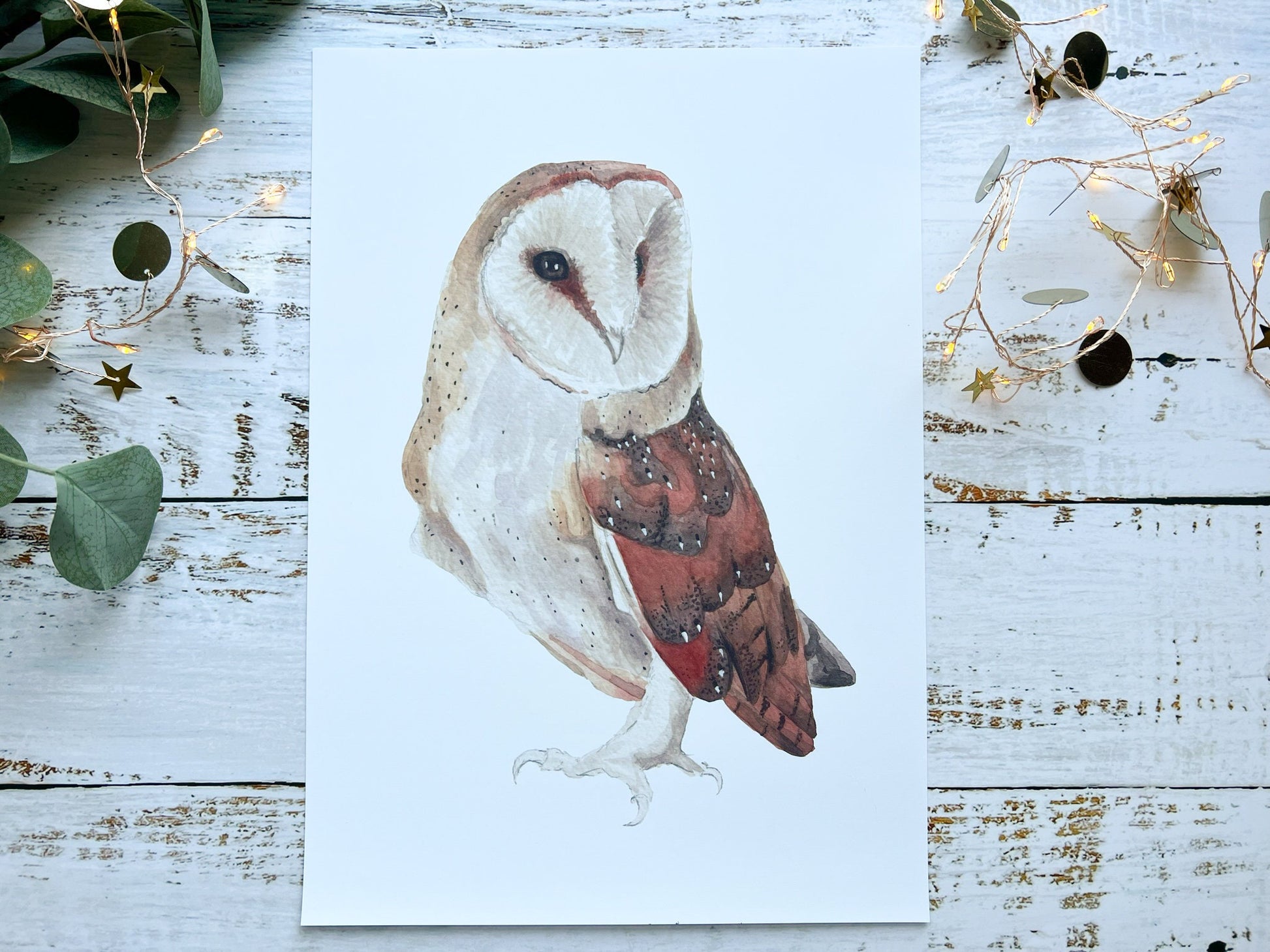 A watercolour print of a barn owl