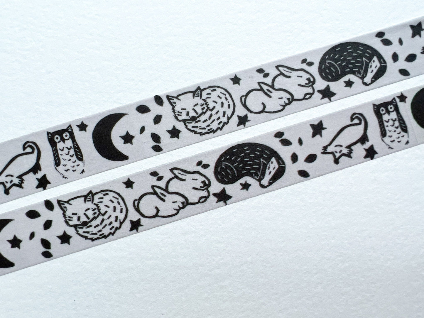 A close up of washi tape that's based on a lino print of woodland animals