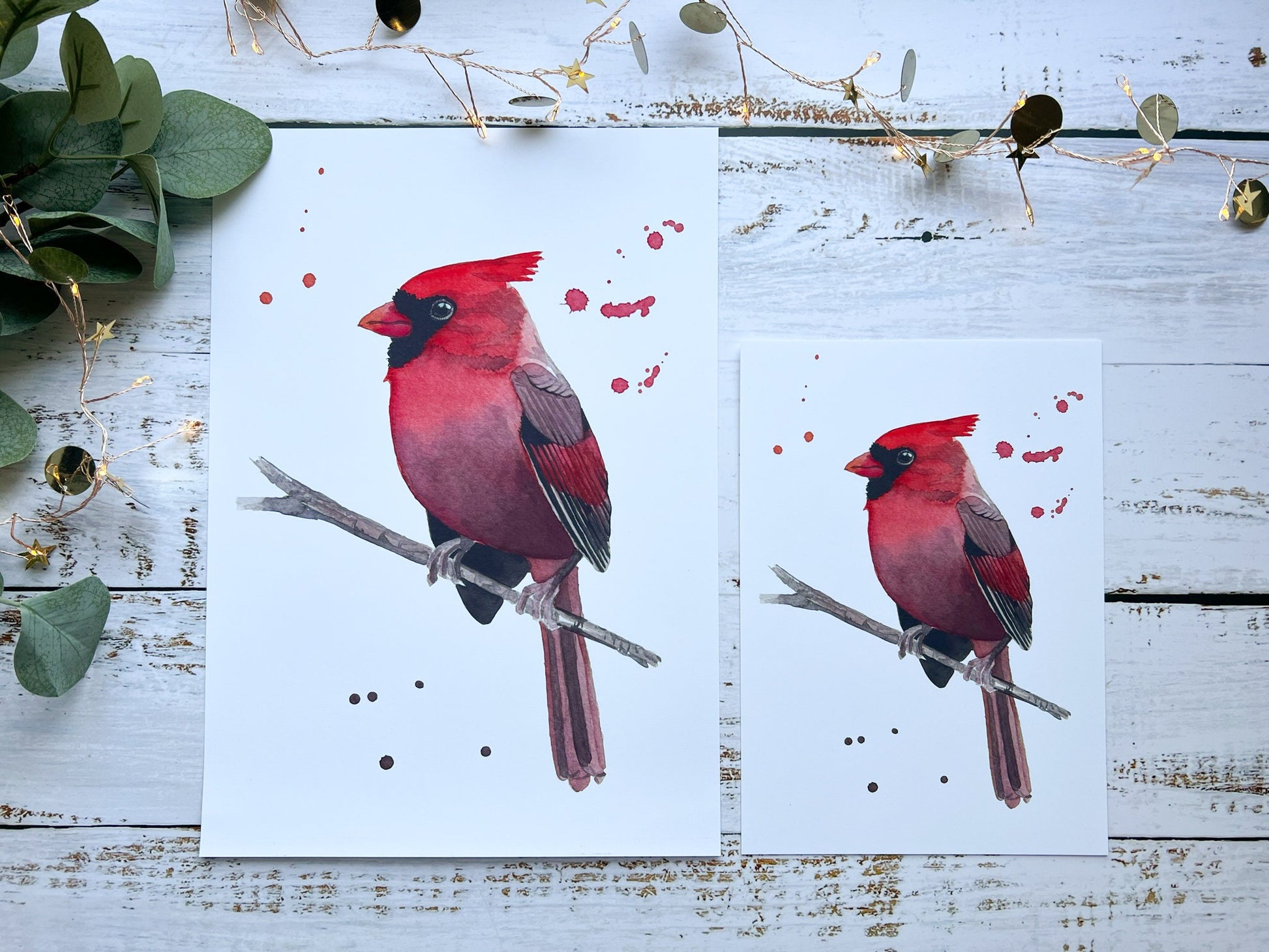 A print of a watercolour painting of a cardinal looking to the side