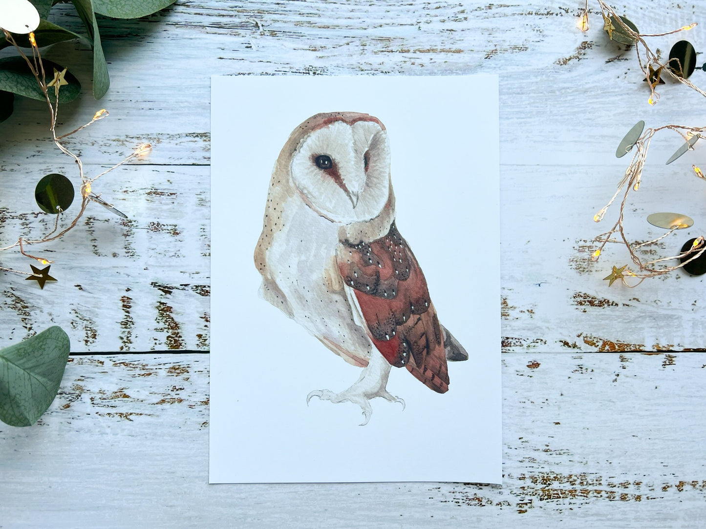 A watercolour print of a barn owl